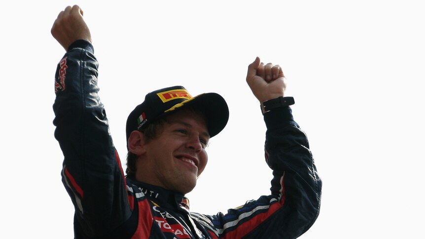 Sebastian Vettel raises his hands in victory in Italy