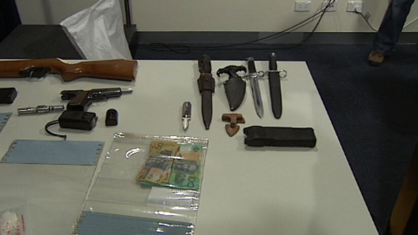 Police seized guns, drugs and cash during the raids.