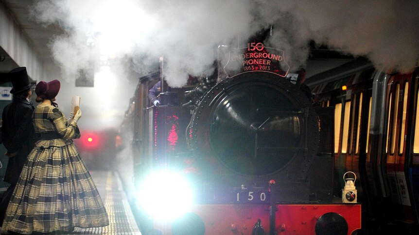 A steam train arrives at Moorgate Underground Station in central London to mark 150th anniversary.