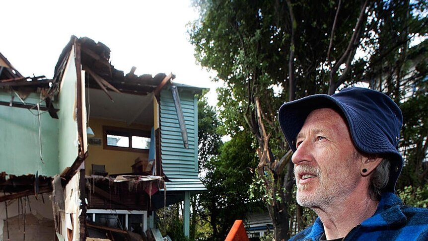 Mike Barthelmeh returns to inspect his earthquake-damaged property