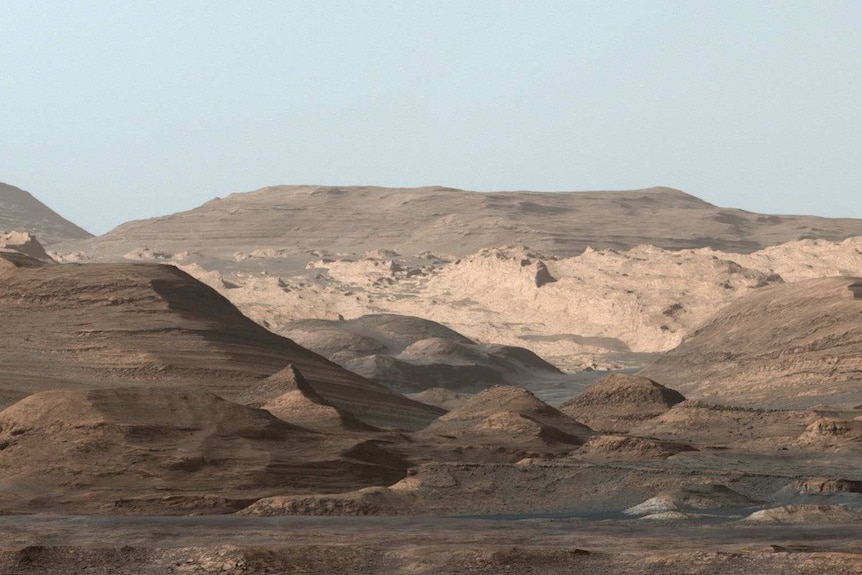 The view looking towards Mount Sharp on Mars showing high, rounded peaks