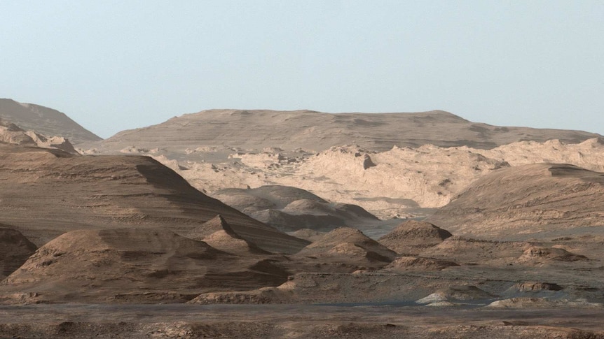 The view looking towards Mount Sharp on Mars showing high, rounded peaks