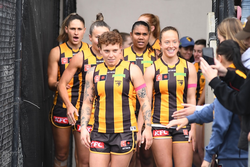 Tilly Lucas-Rodd leads the Hawthorn AFLW side out of the race for a practice match