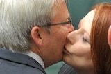 Prime Minister Julia Gillard kisses Foreign Minister Kevin Rudd after the Carbon Tax was passed