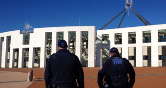 340x180 custom image of AFP officers outside Parliament House in Canberra