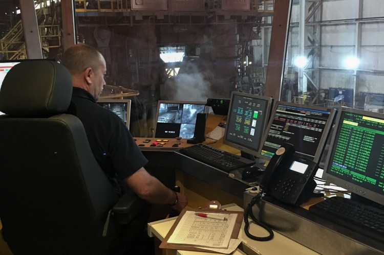 A man sits at the controls of the Liberty Steel's plate mill.