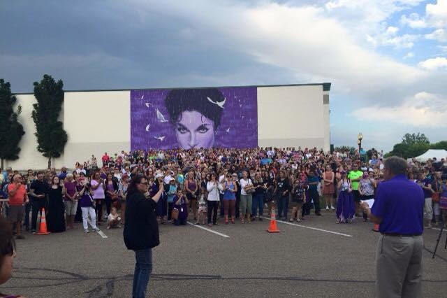 Wedding group in front of Prince mural