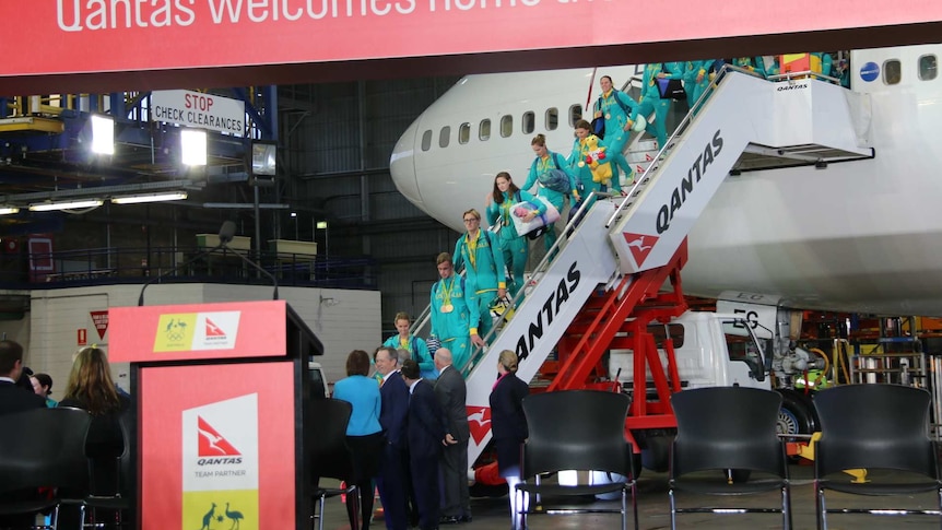 Australia's Olympic team disembarks plane in Sydney