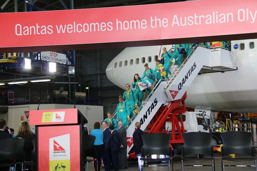 Australia's Olympic team disembarks plane in Sydney