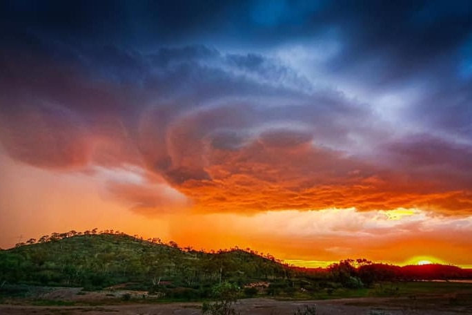 a storm cloud over an outback setting
