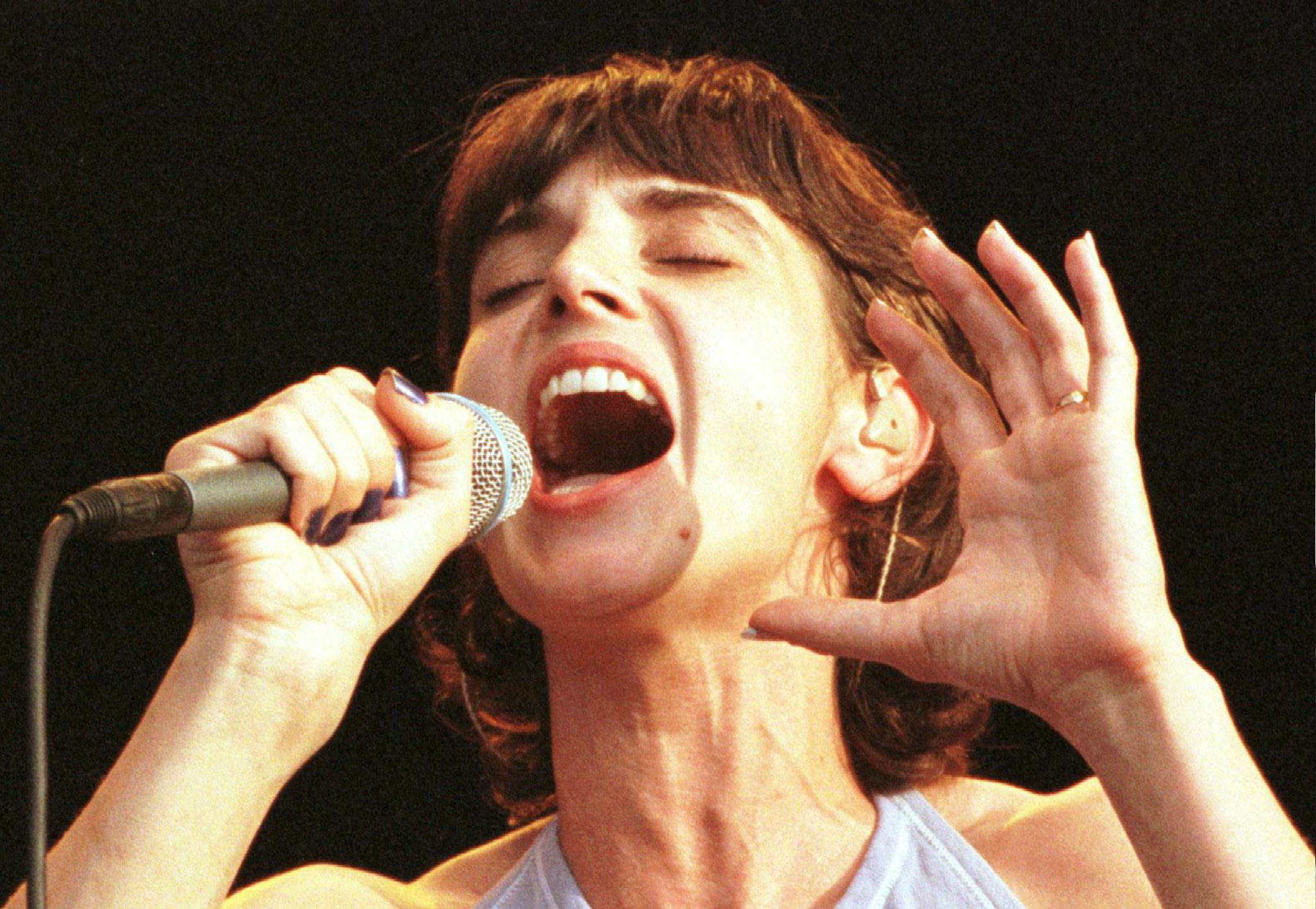 Woman holds microphone 