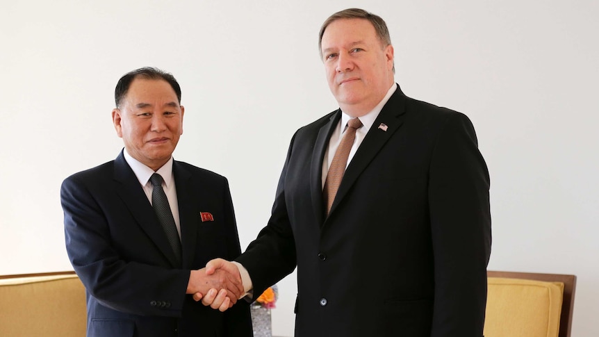 Pompeo and Kim Yong-Chol shaking hands