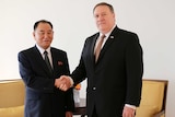 Pompeo and Kim Yong-Chol shaking hands
