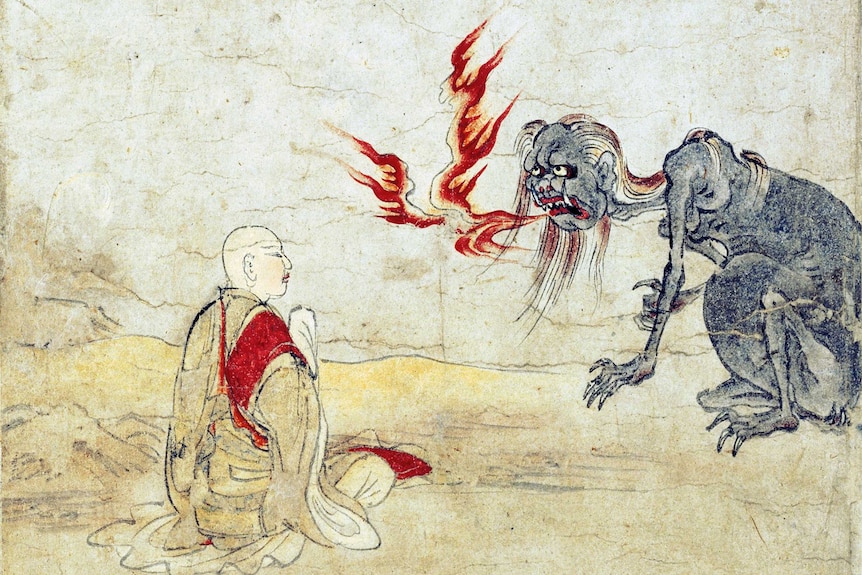 An artwork on paper shows a monk face to face with a preta, a miserable hell being with a bulging stomach, breathing fire.