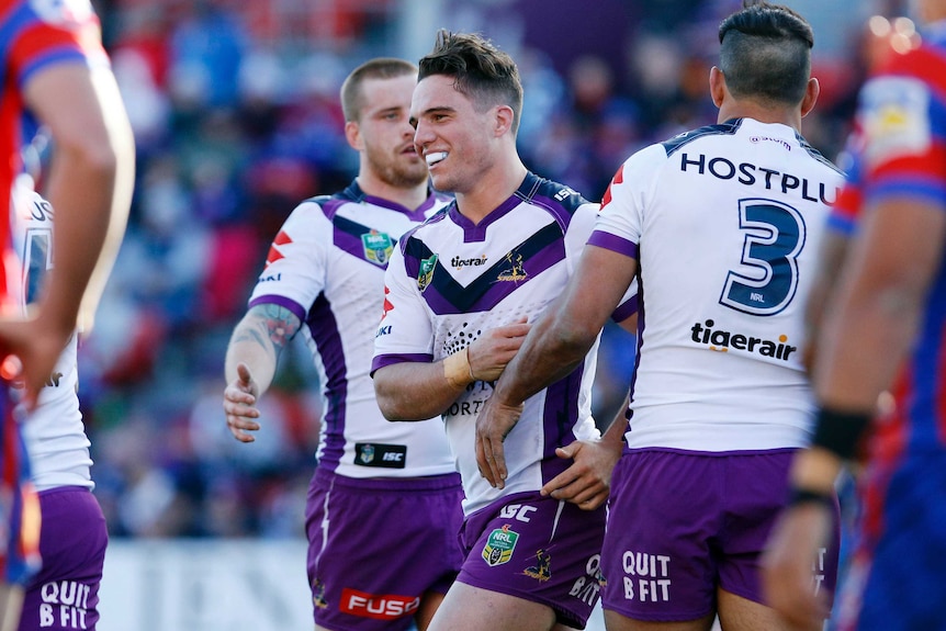 Brodie Croft celebrates a try for the Melbourne Storm.