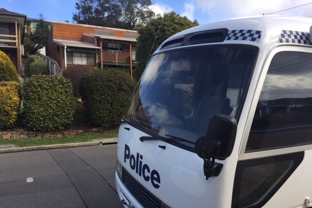 Police attend the missing man's house in Riverside, Launceston