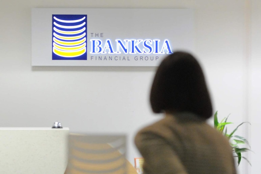 A woman enters the office of the Banksia Financial Group in Melbourne.