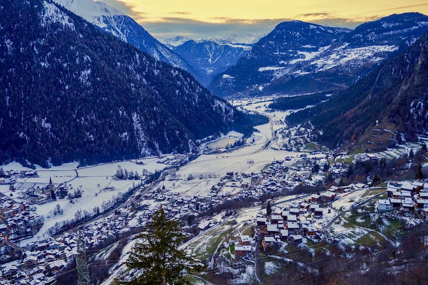 A small village between snowy mountains