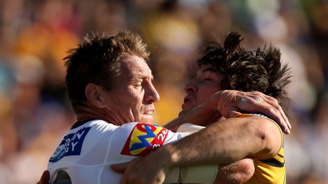 Brad Thorn of the Broncos is tackled by Nathan Hindmarsh of the Eels.