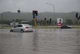 Two cars stuck in floodwaters