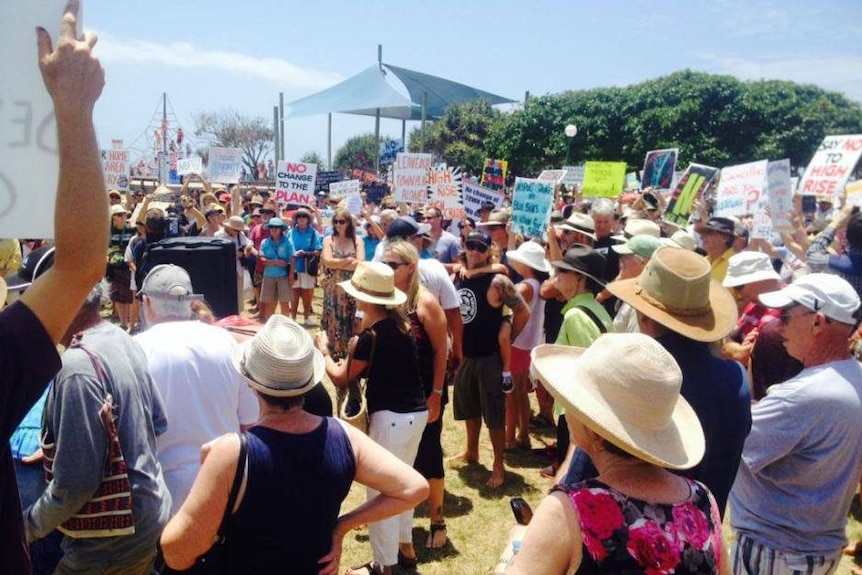 Group of people holding protest signs