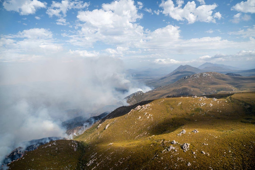 Smoke rises from a fire in south-west Tasmania