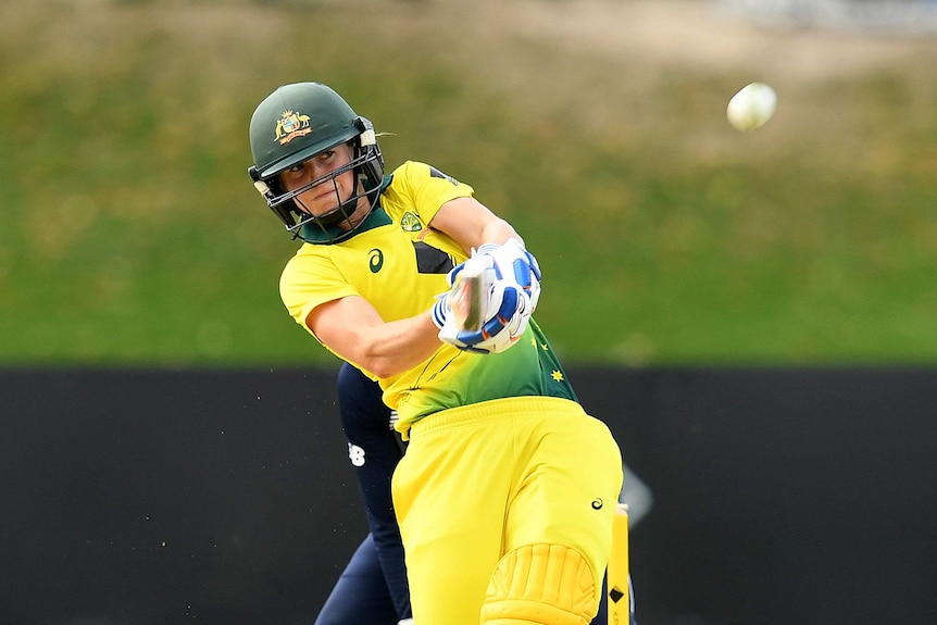 Ellyse Perry of Australia hits a six in the second ODI against England at Coffs Harbour.