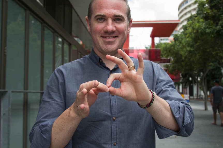 Mark Cave signing on the street. Ausnew Home Care, NDIS registered provider, My Aged Care