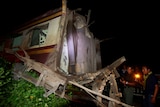 Military personnel inspect a derailed train carriage which was the site of a bomb blast in Pattani, Thailand.