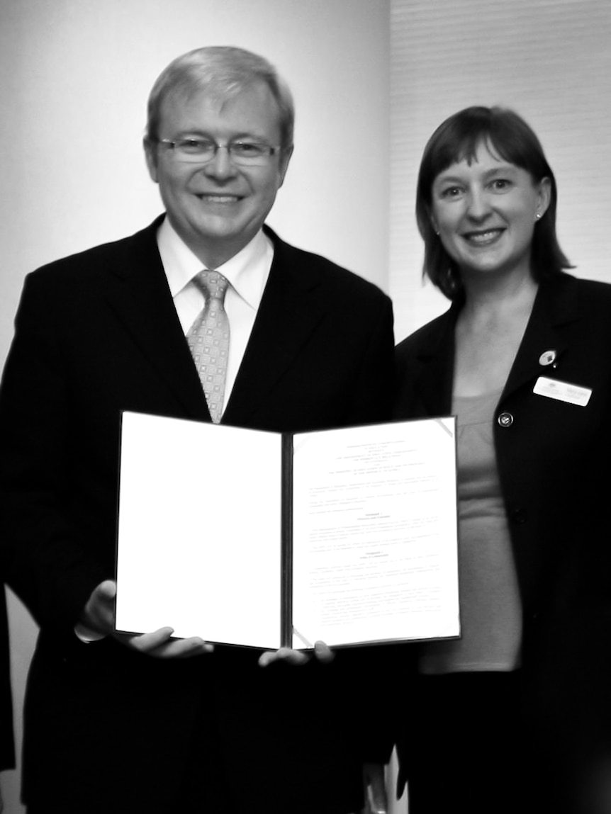 Then Prime Minister Kevin Rudd showcases an educational treaty alongside Mary-Jane Liddicoat