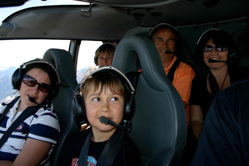 A family inside a helicopter.