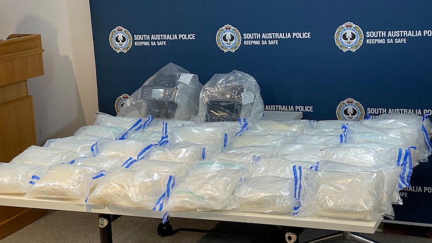 Police display of bags containing methylamphetamine.
