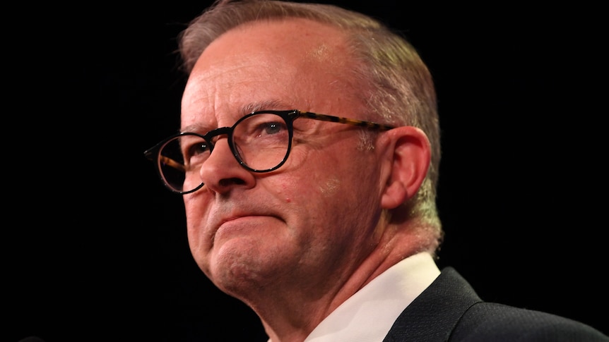 A close up of Anthony Albanese with a look of resolve on his face