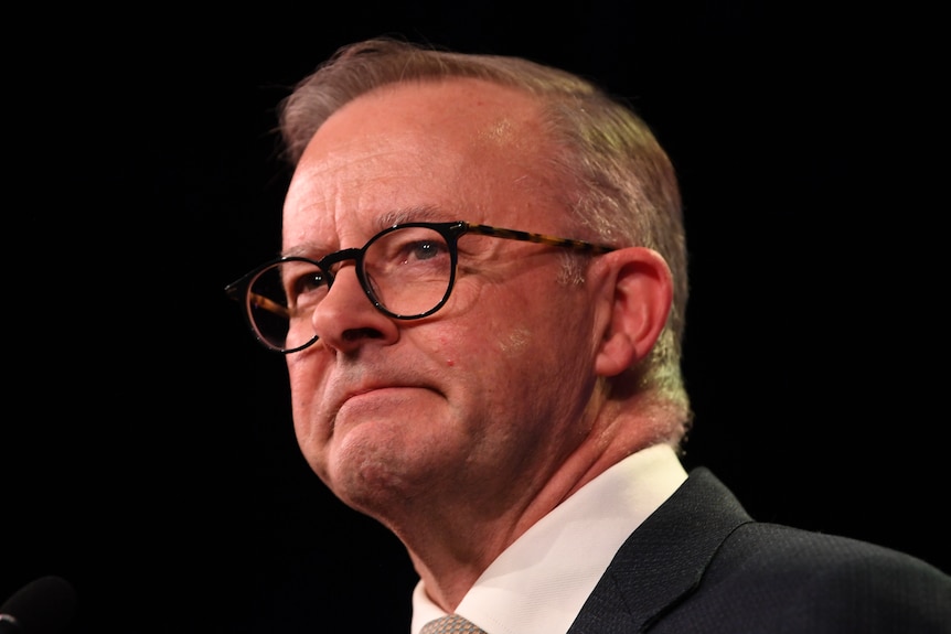 A close up of Anthony Albanese with a look of resolve on his face