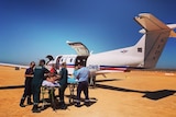 Snake bite victim Nigel Dow being loaded into an RFDS aircraft in January 2022.