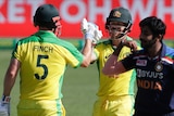 Aaron Finch and David Warner celebrate at the Sydney Cricket Ground