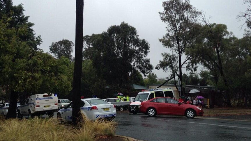 Emergency Services at Queanbeyan Public School after a tree branch fell on a woman and boy.