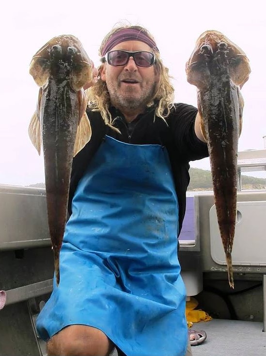 Mark Duncan, aka Mr Flathead, Tasmanian fishing charter operator, with fish.
