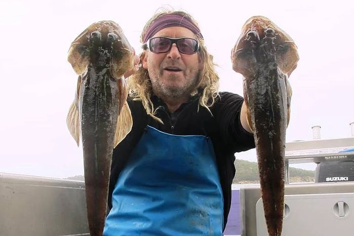 Mark Duncan, aka Mr Flathead, Tasmanian fishing charter operator, with fish.