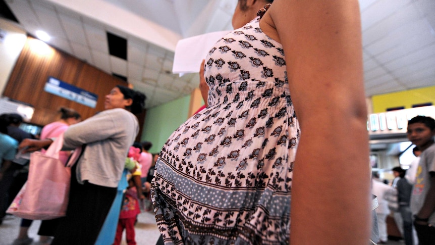 A pregnant woman waits to be treated at a hospital in Honduras.