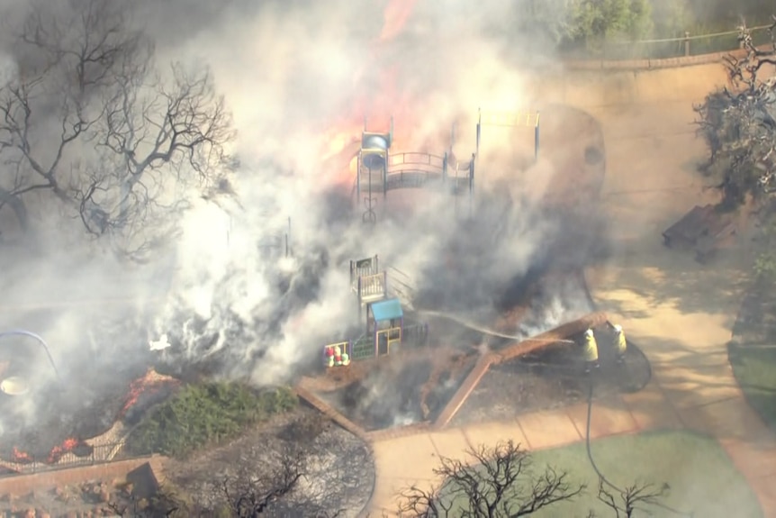 A fire ravages a playground