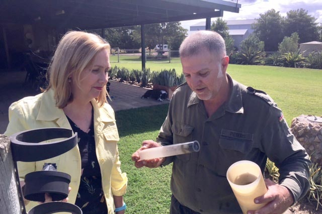 ABC weather presenter Jenny Woodward with cane farmer Phil Marano