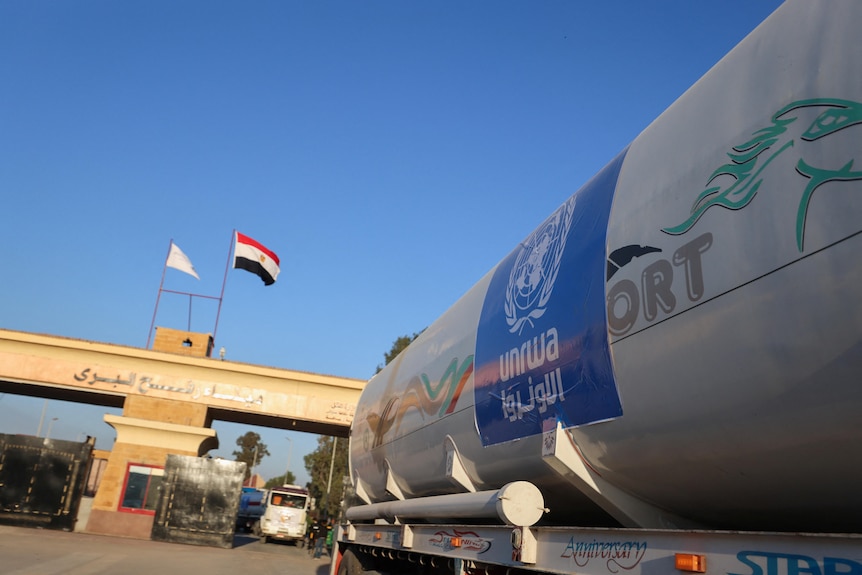 The side of an UNRWA aid truck can be seen near the Rafah border crossing with Egypt