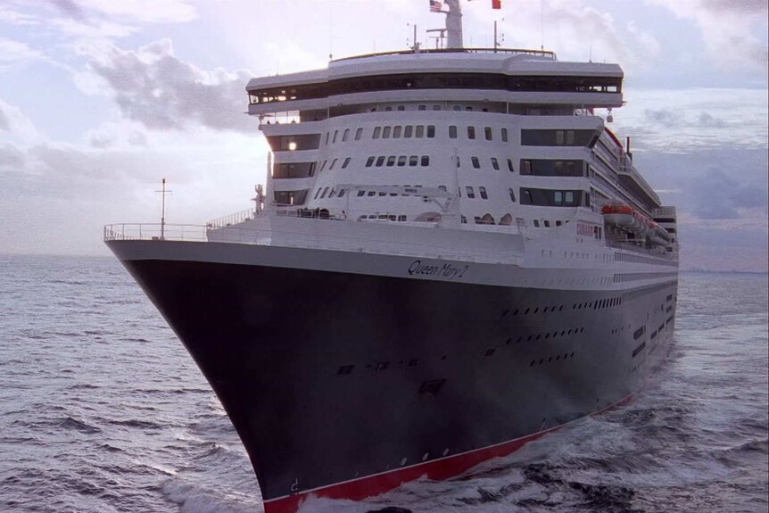 The Queen Mary 2 ship cruises in the open ocean.