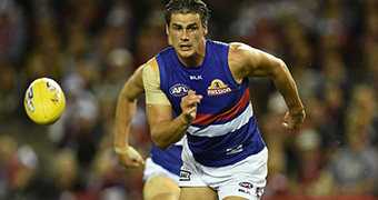 Western Bulldogs player Tom Boyd chases the ball.