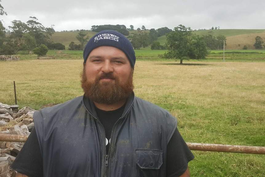 Dairy farmer Mark 'Sparky' Dowling standing in his farm paddock.