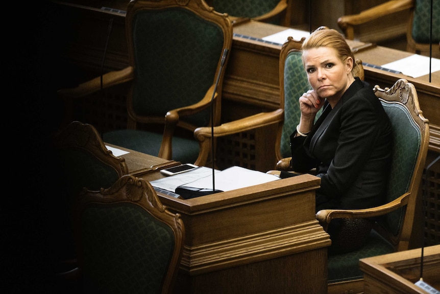 Denmark's Minister of Immigration and Integration Inger Stojberg listen to the debate in parliament.