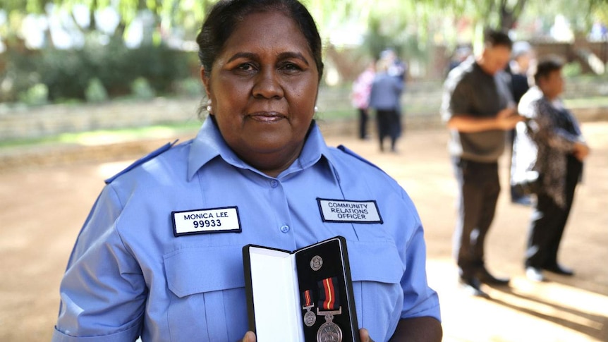 Monica Lee showing off her medal.