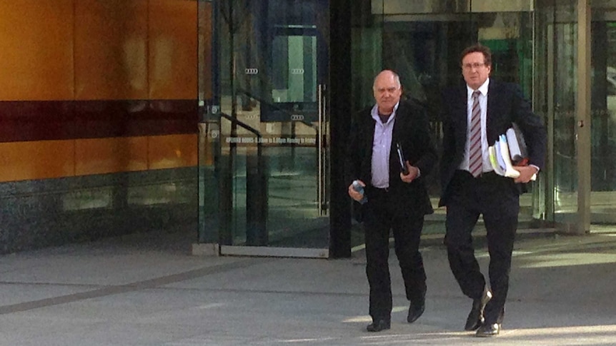 Peter Holt (left) leaves the Federal Court, in Melbourne on September 1, 2015.
