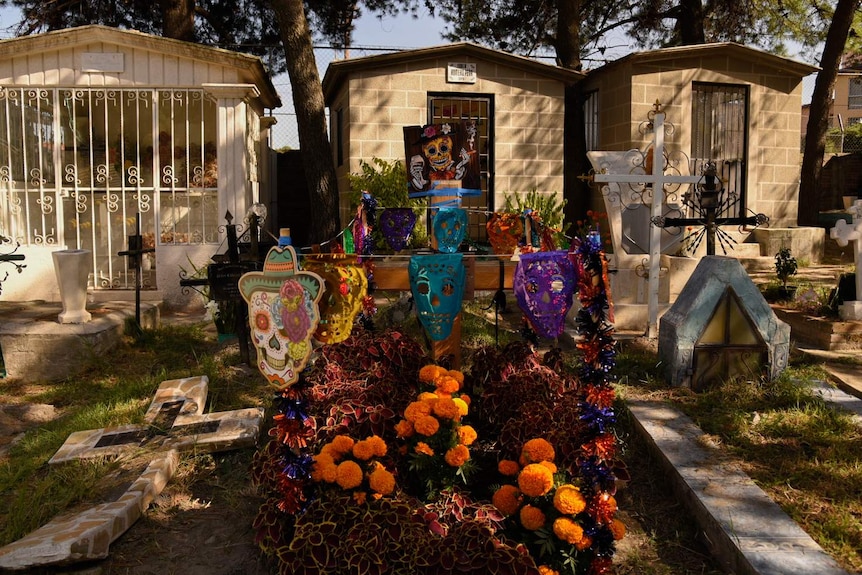 A grave decorated for Day of the Dead in the cemetery in Xochimilco, Mexico City.